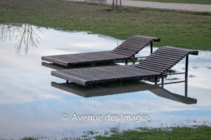 Chaises longues in water