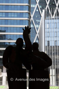 Silhouette of J Jankovic sculpture against 2 towers