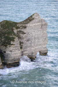 La Falaise d'Amont in the sun at high tide in Etretat, Normandy France