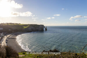 Sun shining on the Etretat bay as the tide recedes